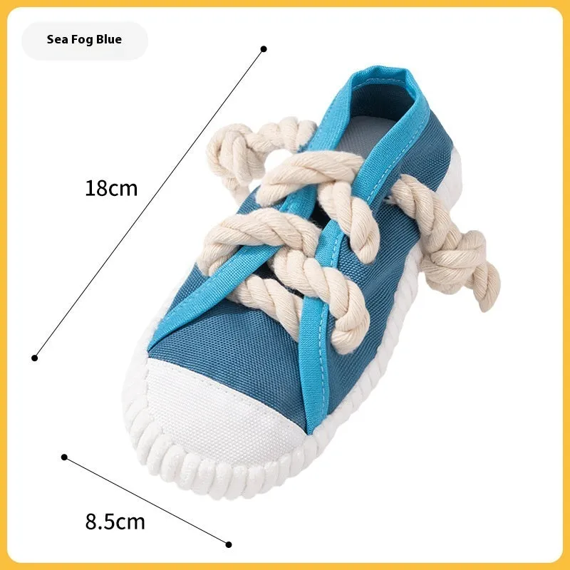 Squeaking plastic dog slipper chew toy in yellow, black, or blue colour.