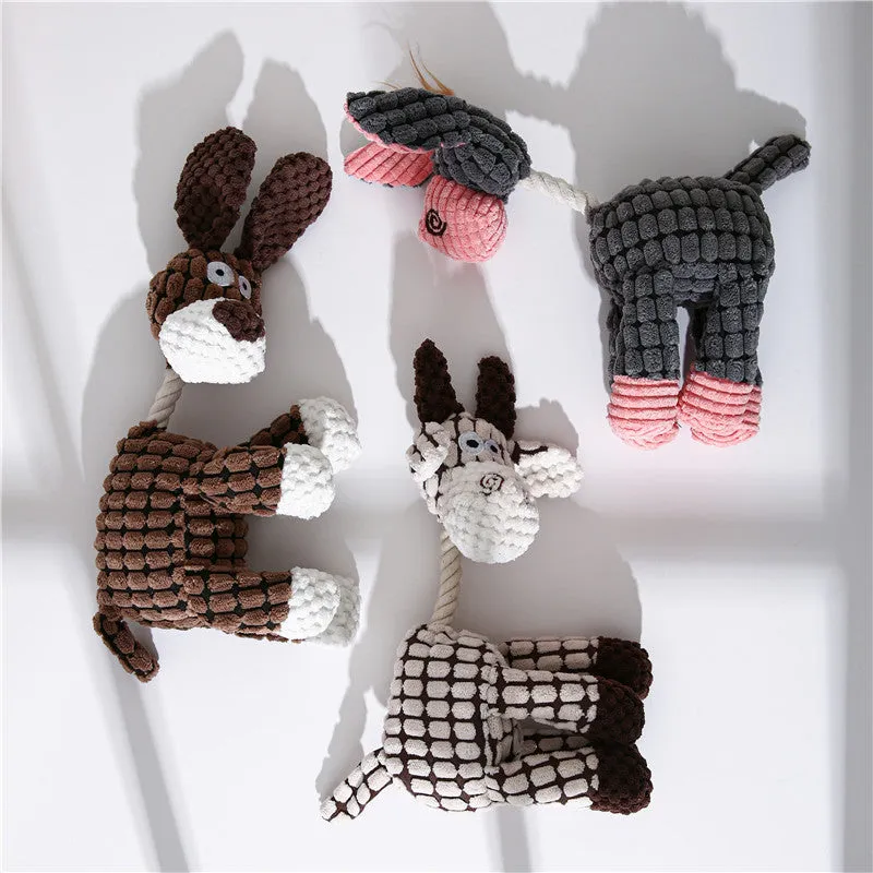 Pink donkey plush dog toy with scrunch and squeak features for interactive play