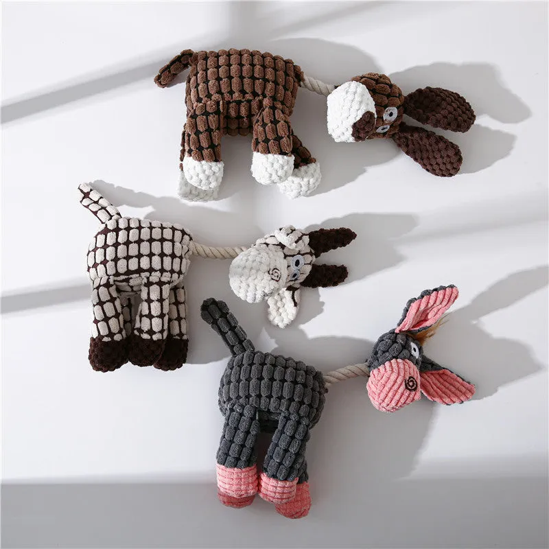 Pink donkey plush dog toy with scrunch and squeak features for interactive play