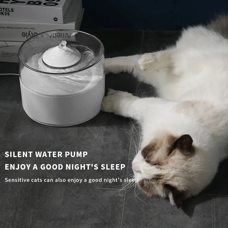 White ABS automatic cat drinking fountain on a flat surface with water in the bowl