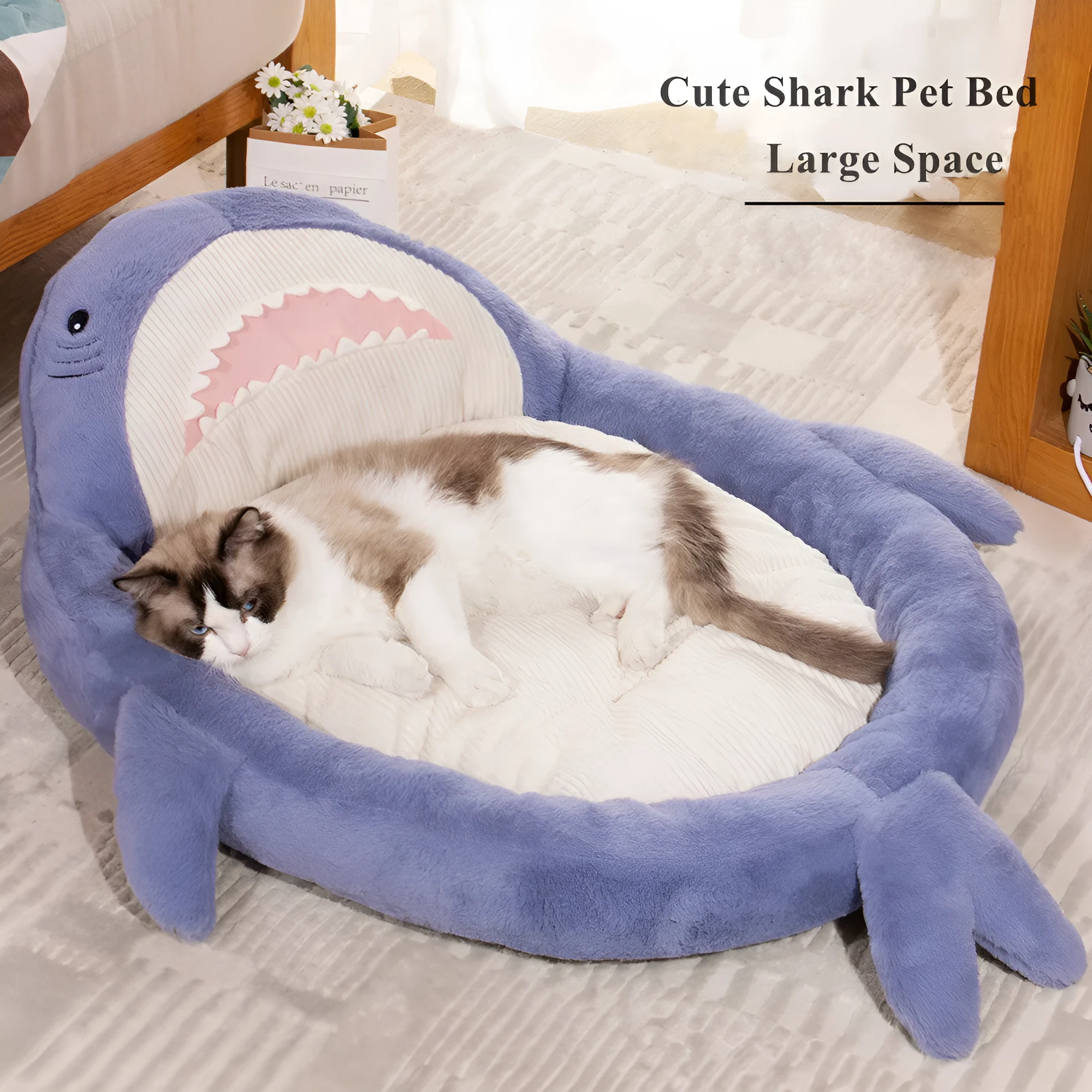 Blue shark pattern pet bed cushion for dogs and cats on a wooden floor