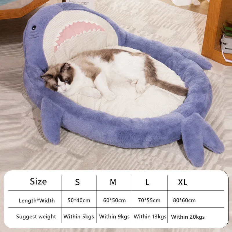 Blue shark pattern pet bed cushion for dogs and cats on a wooden floor