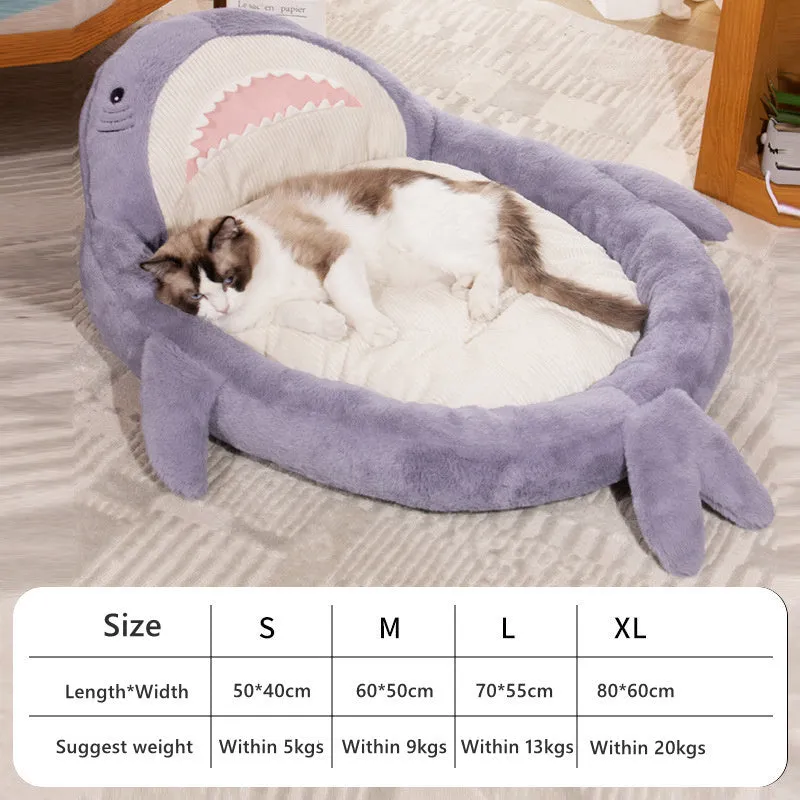 Blue shark pattern pet bed cushion for dogs and cats on a wooden floor