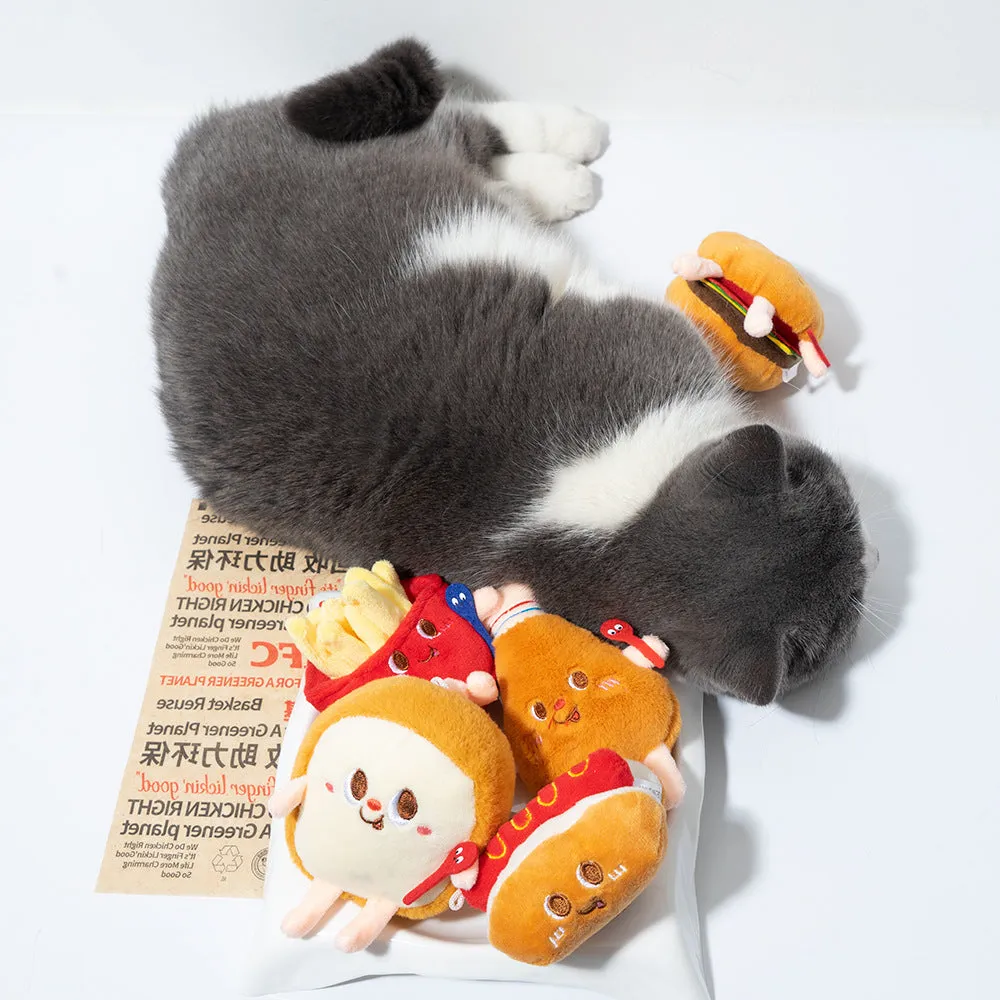 Cat chewing toy shaped like hamburger and chicken leg with catnip filling