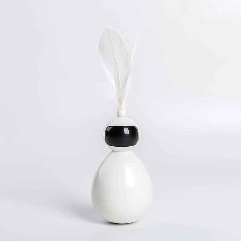 Tumbler cat toy in white with three replacement feathers on a light background