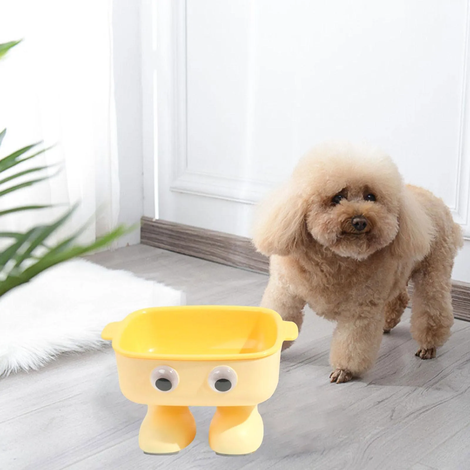 Green robot-shaped elevated cat bowl with tilted design and removable inner bowl on anti-slip base