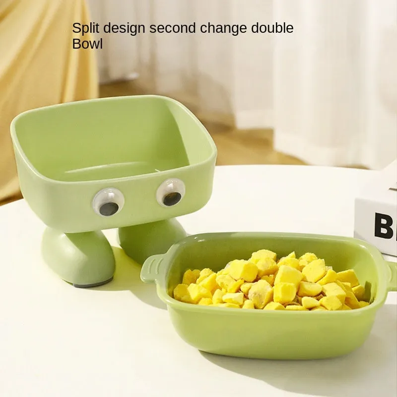 Green robot-shaped elevated cat bowl with tilted design and removable inner bowl on anti-slip base