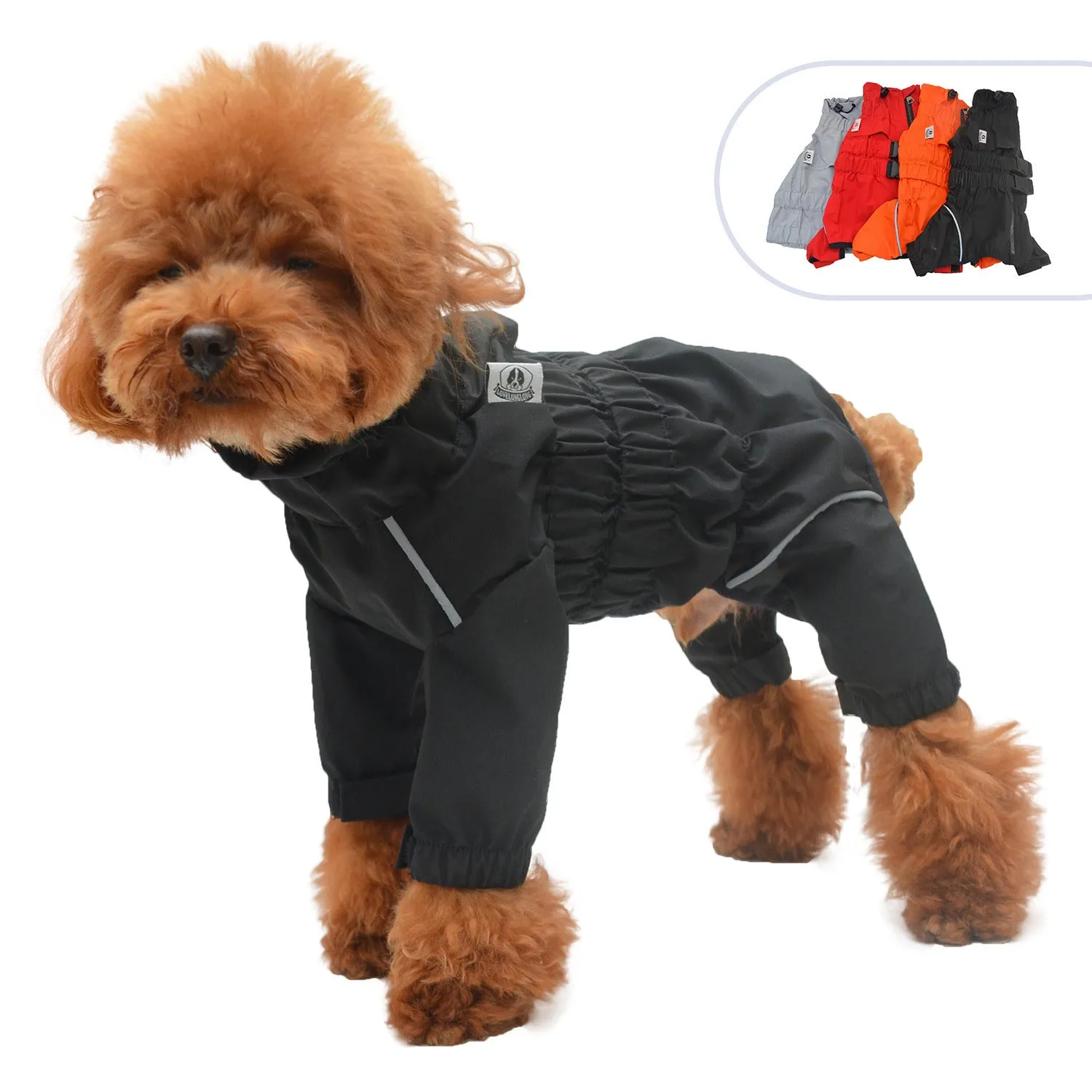 Outdoor four legged dog raincoat in polyester, black colour, on a dog standing in wet grass