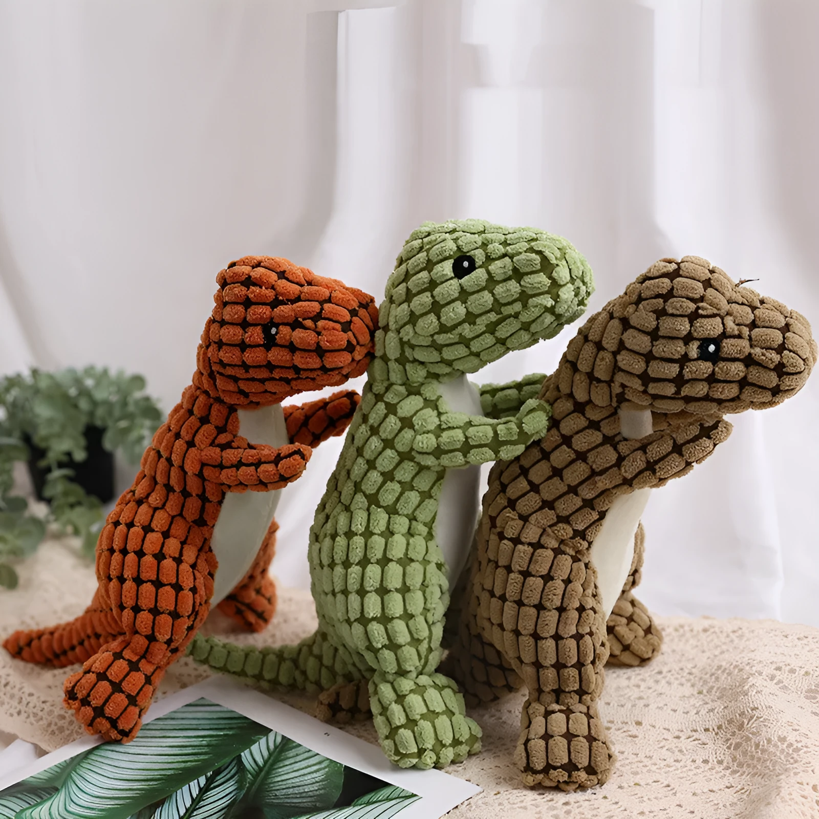 Dog bite resistant plush sounding toy dinosaur in corn wool, orange colour, 29x14cm