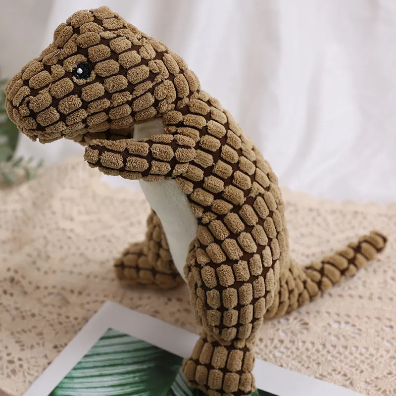 Dog bite resistant plush sounding toy dinosaur in corn wool, orange colour, 29x14cm