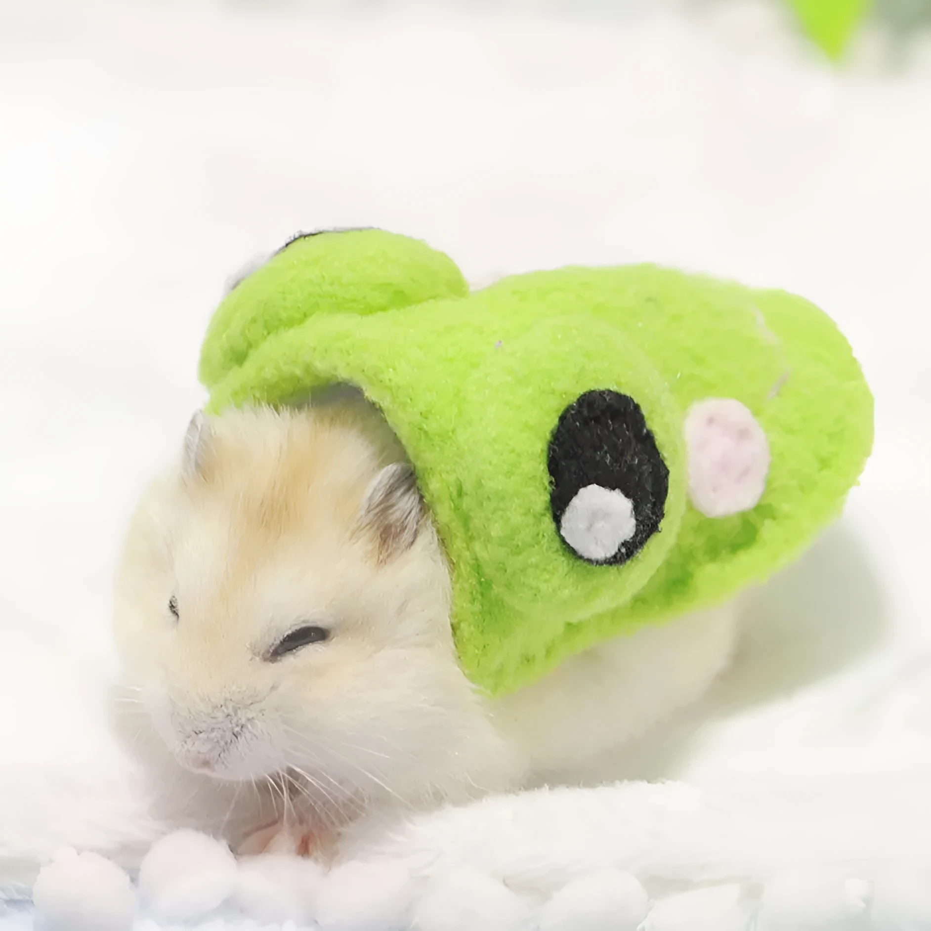 Pet hamster wearing a bunny costume in a cute style, showing the thin fabric design