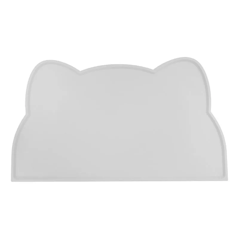 Blue cat head shaped silicone pet feeding mat placed under food and water bowls.