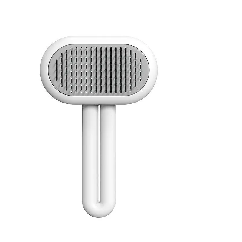 Grey capsule cat dog grooming comb with stainless steel needles on surface