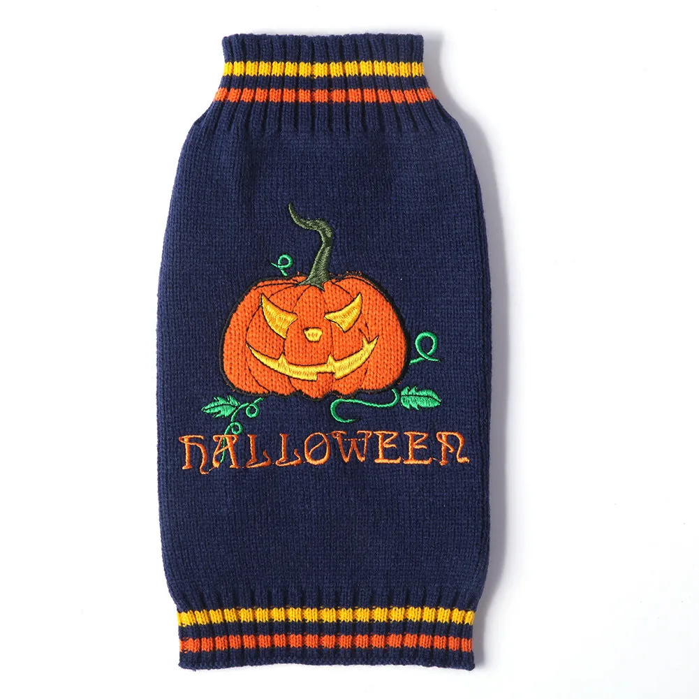 Dog wearing a knitted pumpkin sweater in orange black pumpkin colour, standing on a wooden floor