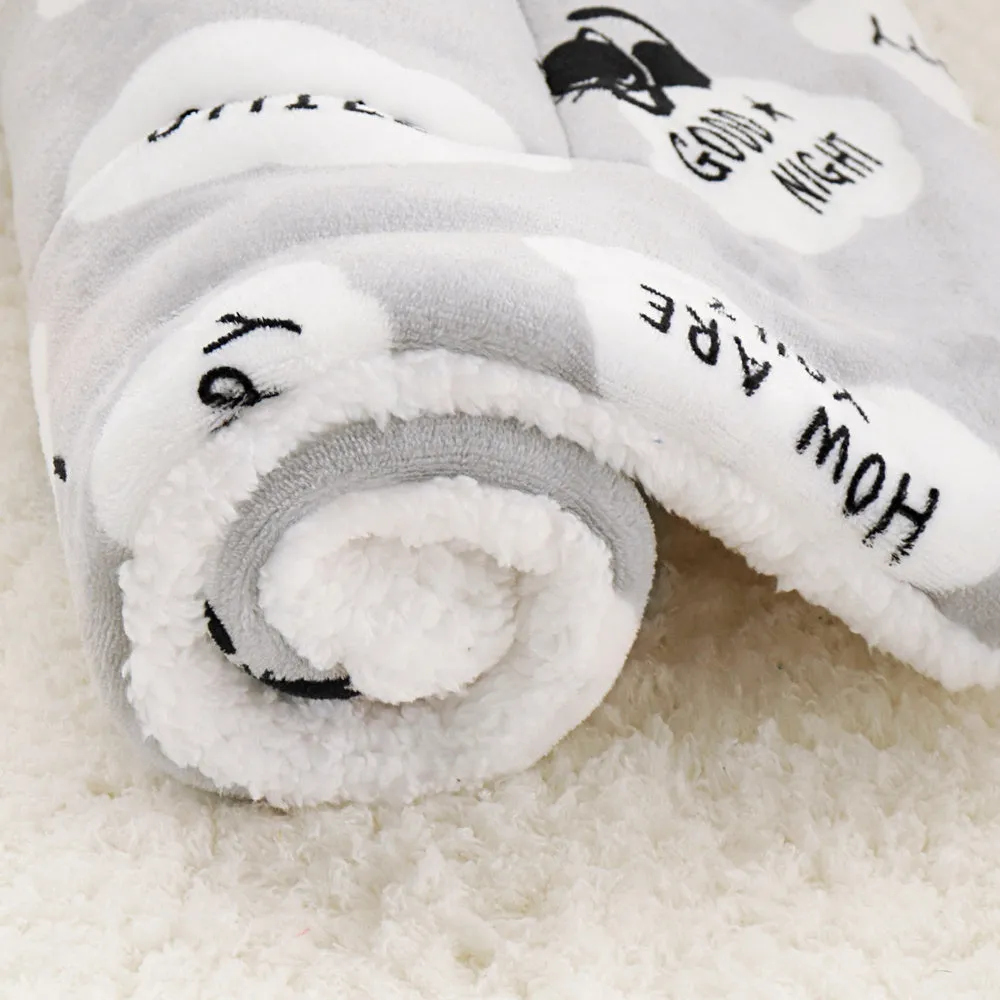 Lambskin pet blanket in flannel cashmere with cute cartoon pattern, grey colour, 55x70cm size on a pet bed