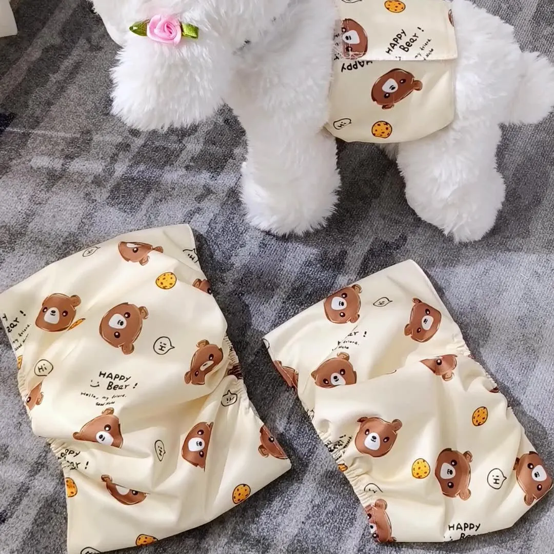 Reusable male dog diaper belly band with cartoon bone paw print design and fastener tape.