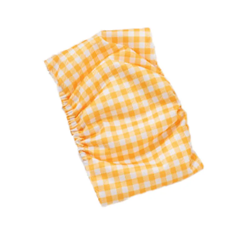 Reusable male dog diaper belly band with cartoon bone paw print design and fastener tape.