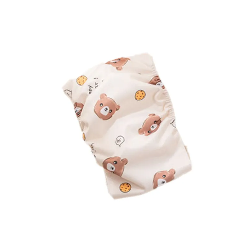 Reusable male dog diaper belly band with cartoon bone paw print design and fastener tape.