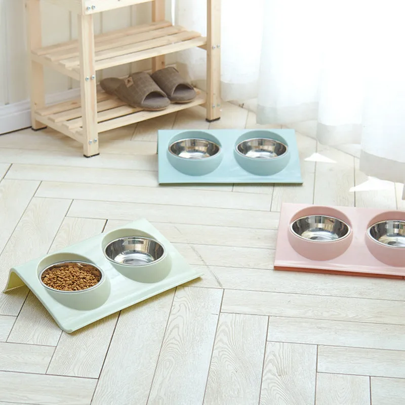 Stainless steel pet double bowl with green PP base and metal inner bowl on floor