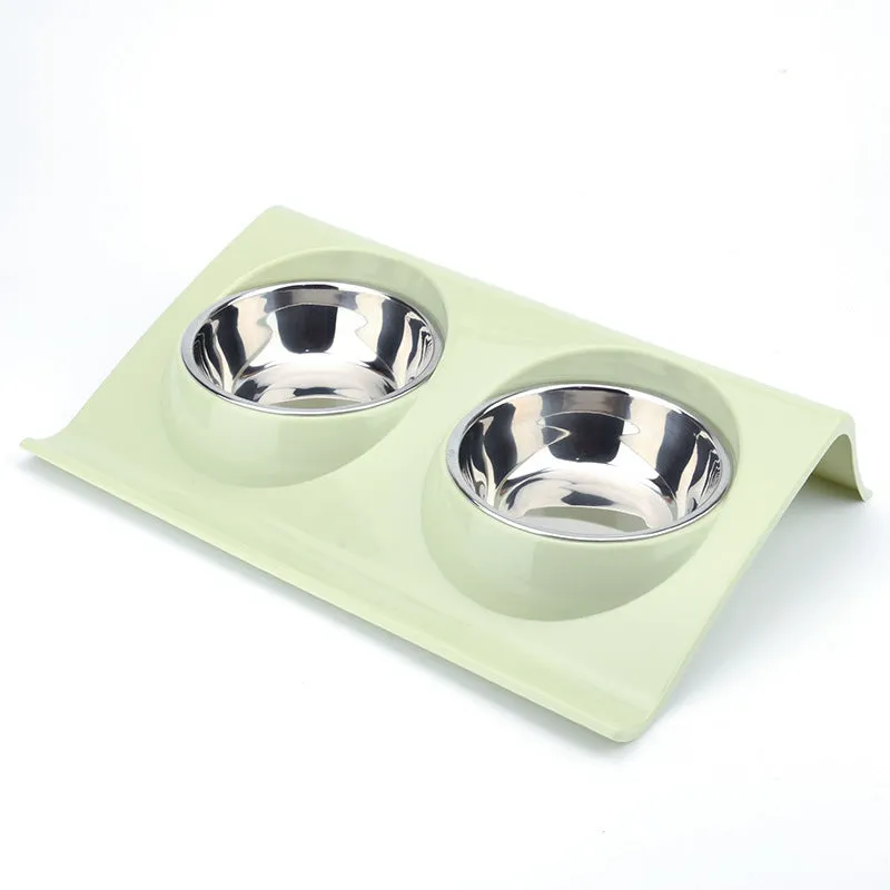 Stainless steel pet double bowl with green PP base and metal inner bowl on floor