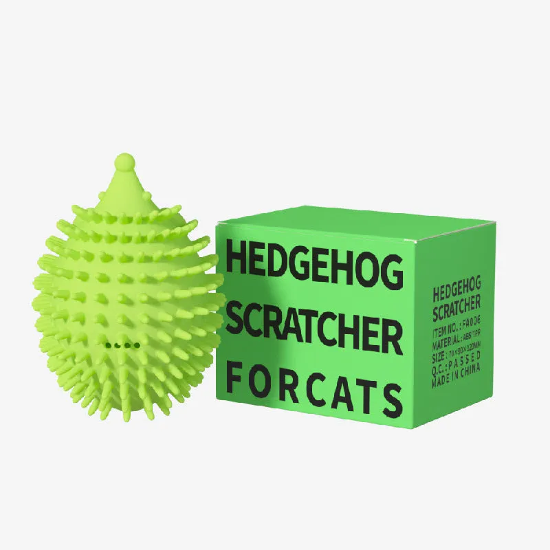 Green cat corner scratcher with plastic base and long teaser stick on a light background