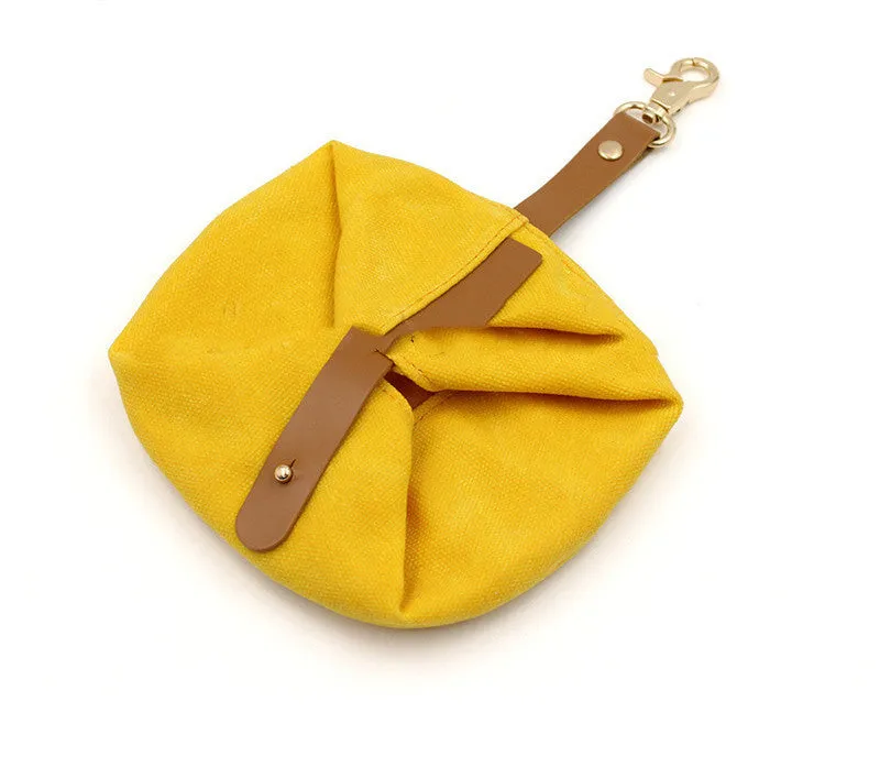 Folding canvas dog bowl in green, grey, and yellow, 15cm diameter, for portable pet feeding