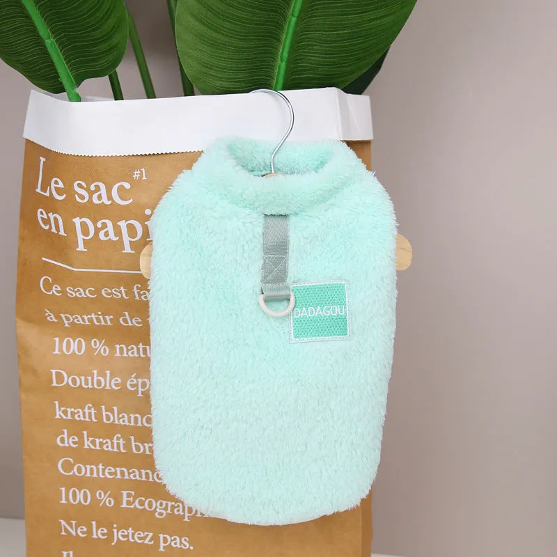 A soft coral fleece dog jacket shown in blue, available in sizes S to XXL.