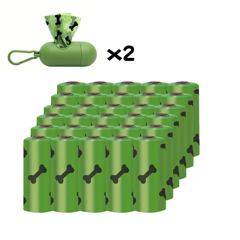 Biodegradable thickened dog poop bags in black and green on a roll with dispenser for pet waste cleanup.
