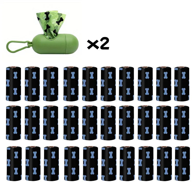 Biodegradable thickened dog poop bags in black and green on a roll with dispenser for pet waste cleanup.