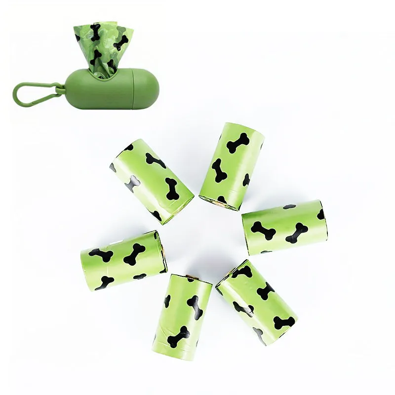 Biodegradable thickened dog poop bags in black and green on a roll with dispenser for pet waste cleanup.