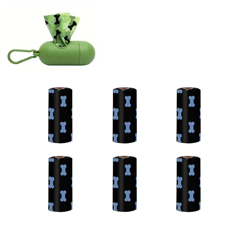 Biodegradable thickened dog poop bags in black and green on a roll with dispenser for pet waste cleanup.