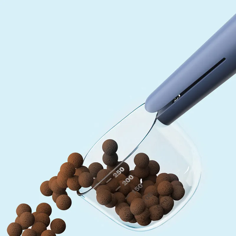 Transparent plastic pet food spoon with scale markings for measuring cat and dog dry food, available in Blue Pink White
