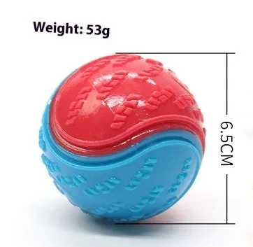 TPR dog training ball with squeaker in bright two-tone colours, showing molar texture on surface.