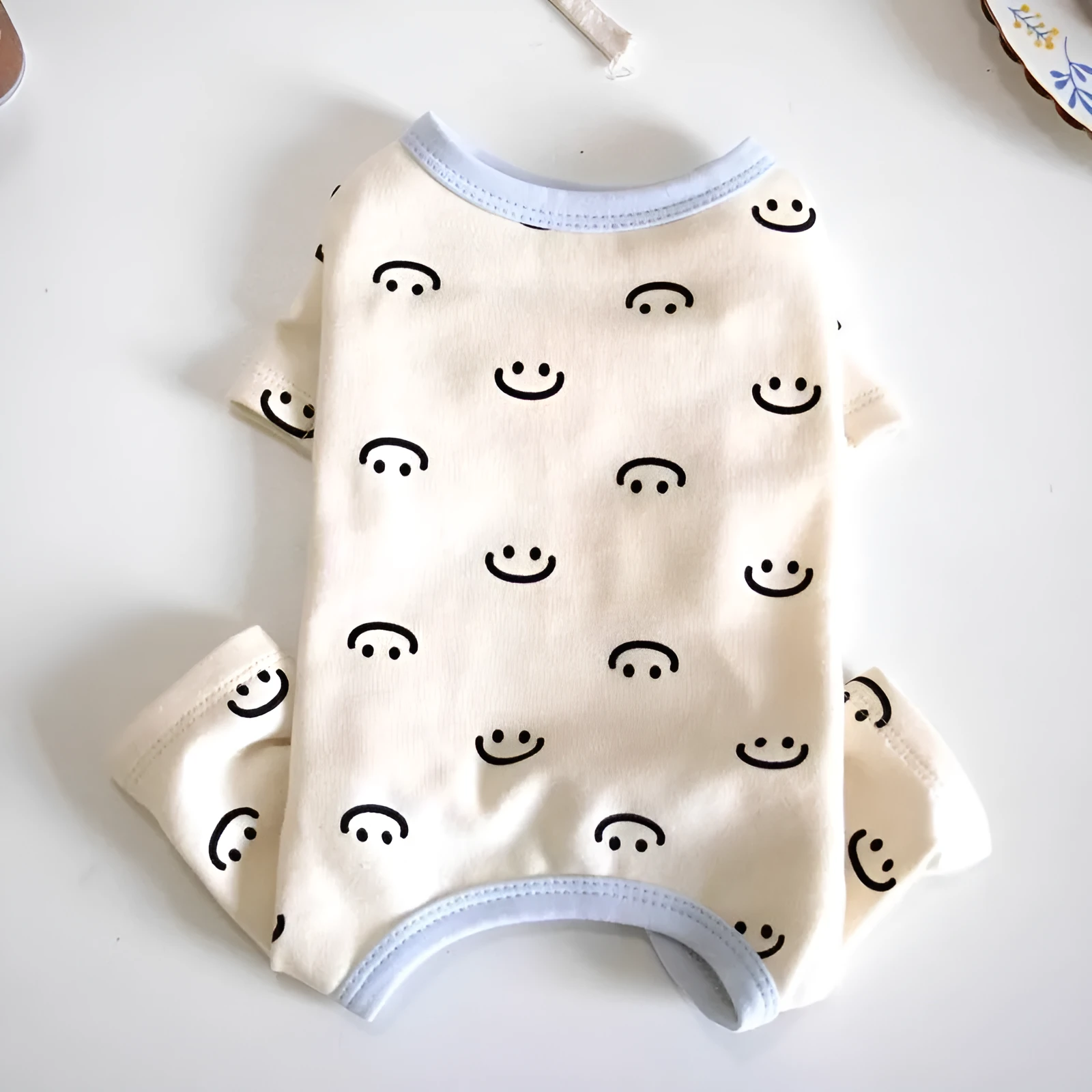 Four-legged rubber cat pyjamas with smiling face pattern, sizes XS to 2XL