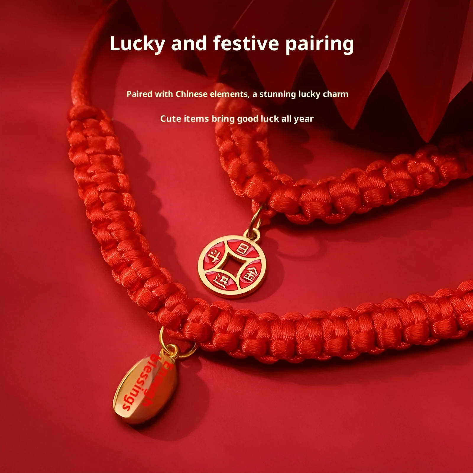 Adjustable hand-woven red rope pet collar with alloy lucky charm on wooden surface