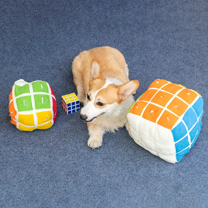 Pet Rubik's Cube sniffing toy in polar fleece fabric with treats visible, 15cm cube on a light background