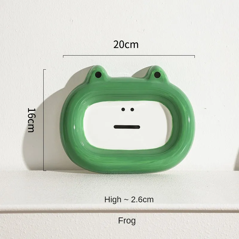 Glazed ceramic pet food bowl with animal design and non-slip rubber base ring.