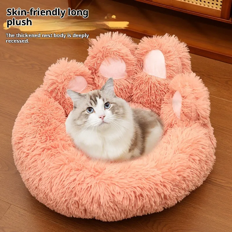 Round plush pet bed in coffee colour with raised rim and textured hand-shaped brush nest surface