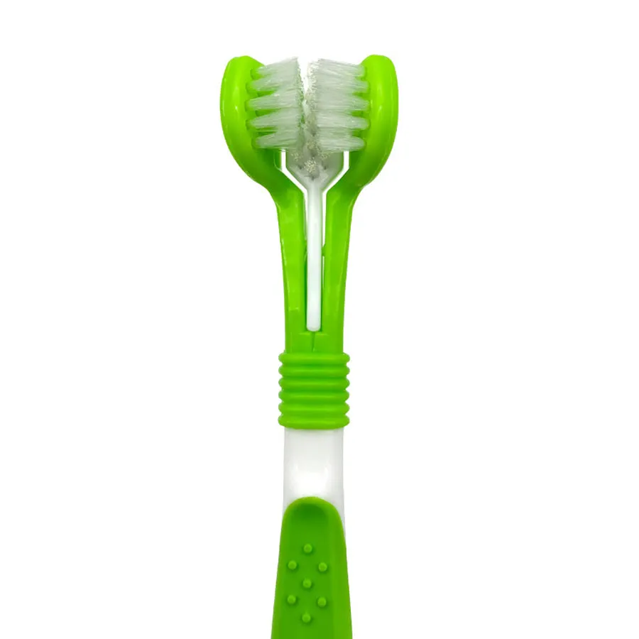 Green pet silicone finger toothbrush set with three-head dog toothbrush and PP handles on a light background