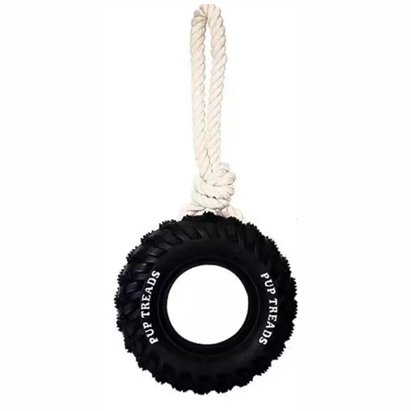 Tough natural rubber dog chew toy shaped like a tire with rope, black colour, for large dogs