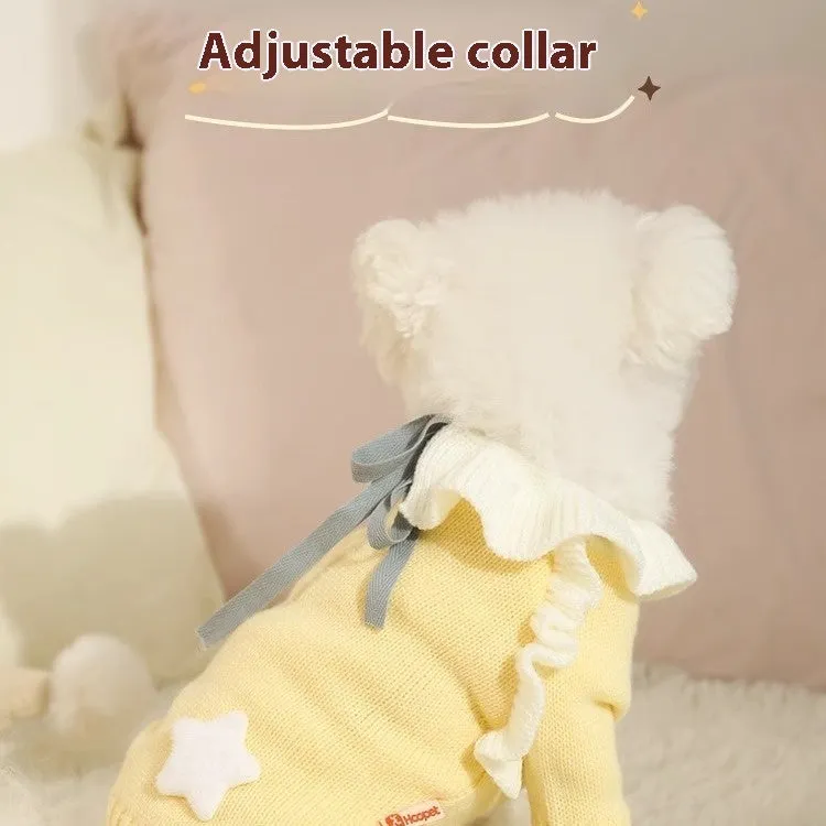 Yellow acrylic dog sweater on a small puppy, showing a casual knitted design.