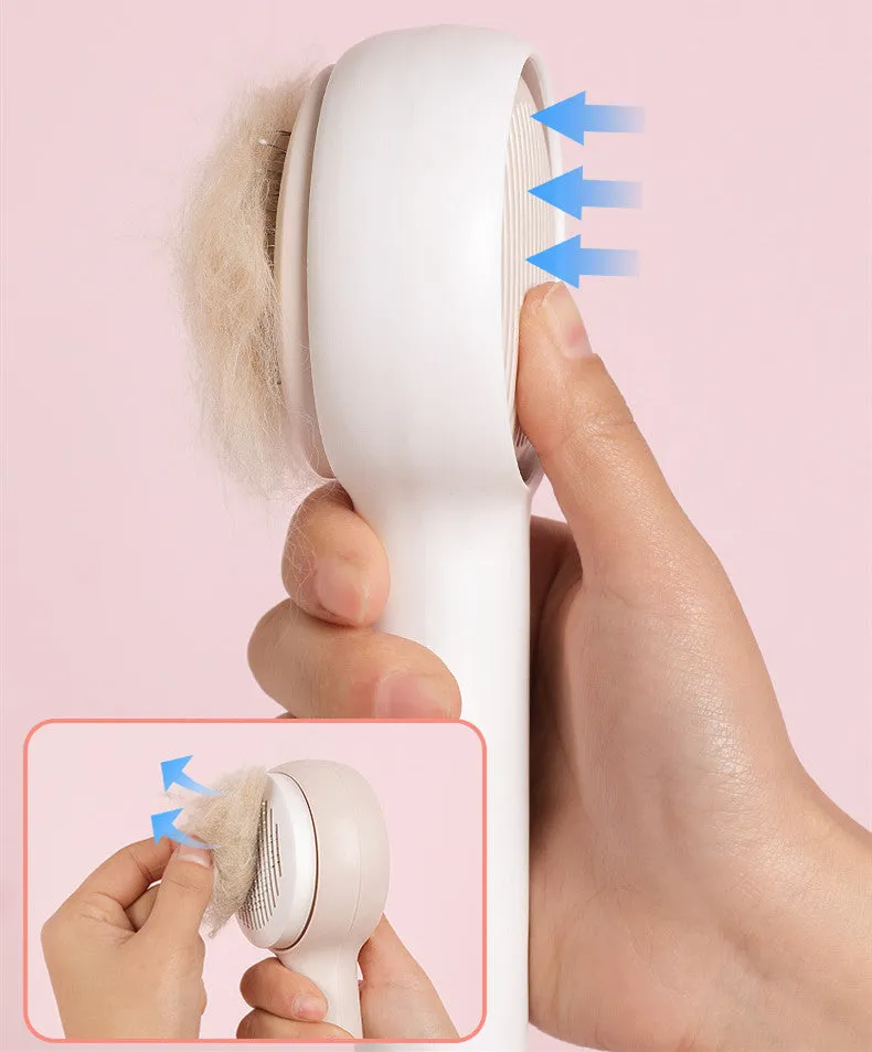Pink cat combing brush floating needle comb for cats and dogs on white background