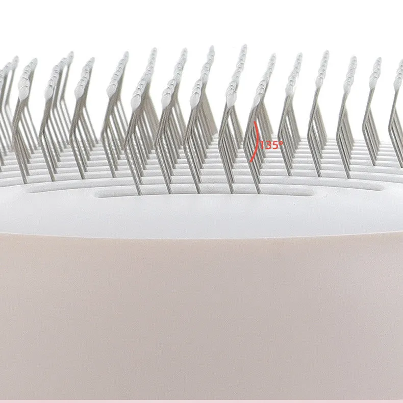 Pink cat combing brush floating needle comb for cats and dogs on white background