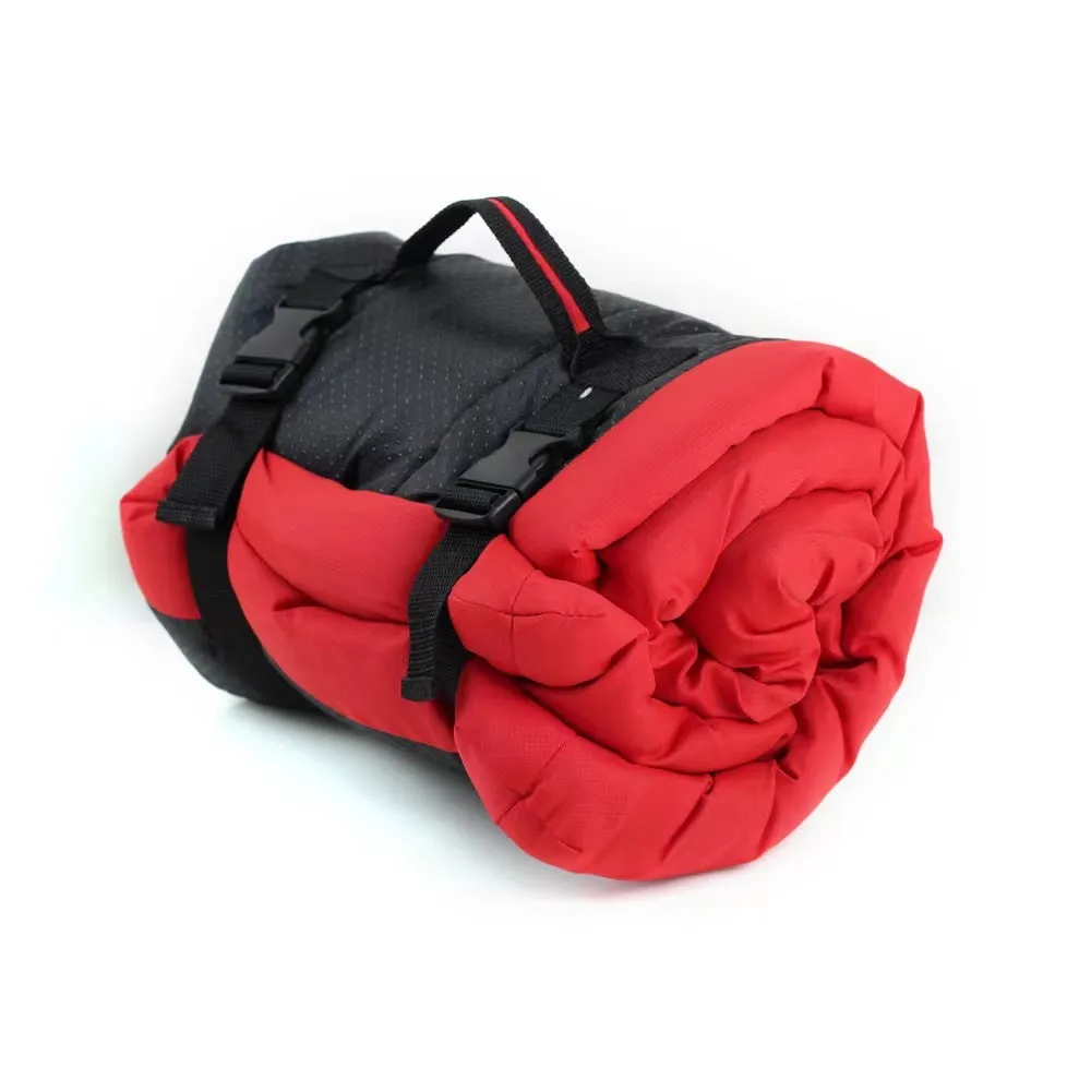 Blue foldable waterproof dog bed shown both open and folded with nylon buckles, on grass.