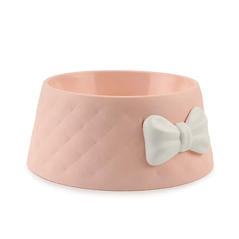 Bow shaped pet feeding bowl in PP plastic available in pink, green, and grey