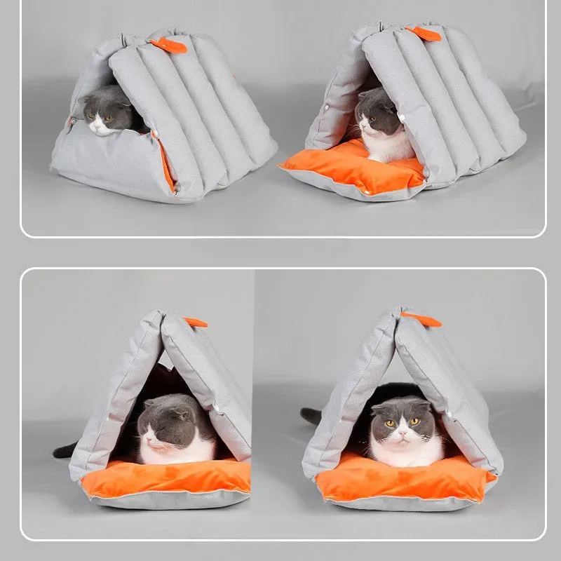 Blue triangular cat bed with raised sides and visible connection holes on a wooden floor.
