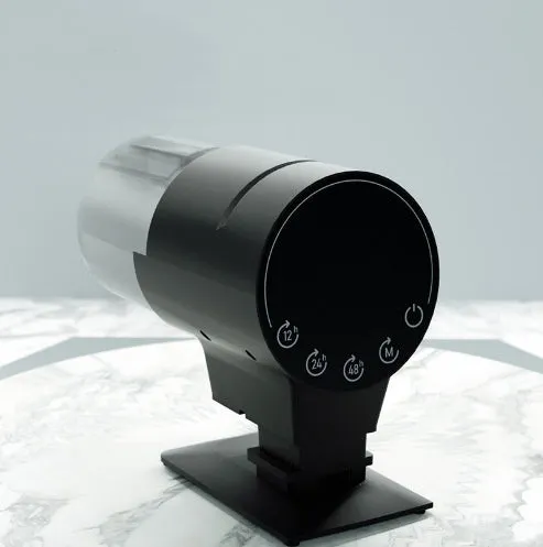 Black plastic automatic aquarium fish feeder with 210ml silo and timer control on tank rim