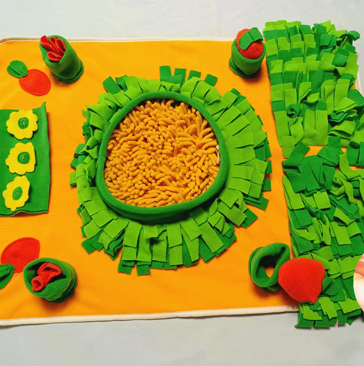 Fleece dog snuffle mat measuring 60 by 80 cm with a carrot pull toy on a cushion-style base for foraging activities