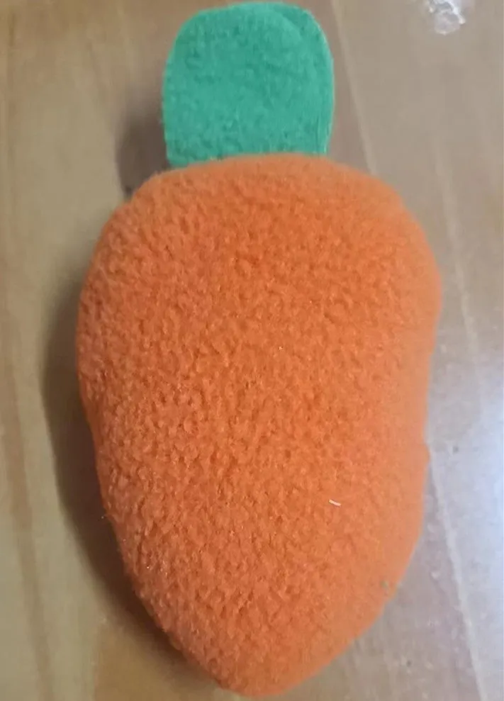 Fleece dog snuffle mat measuring 60 by 80 cm with a carrot pull toy on a cushion-style base for foraging activities