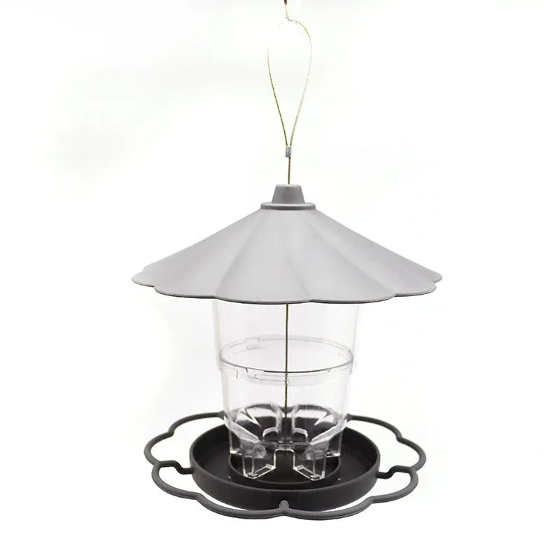 Collapsible wild birds feeder hanging birdcage with removable roof and large capacity bowls in outdoor garden setting